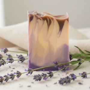 Bar of Creamy Lavender Soothing Natural Soap with purple swirls and dried lavender buds.